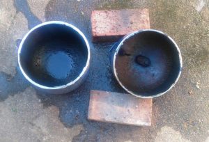 The two halves of the scrapped gas cylinder. Please note that it was full of water when cut. These are the top and bottom of the burn chamber used in the rocket stove upgrade part two
